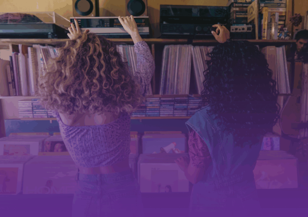 2 people looking at records in a record shop